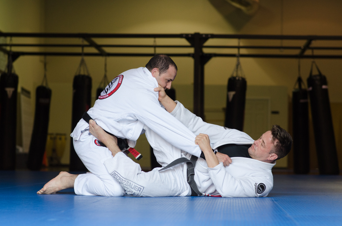 Brazilian Jiu Jitsu partners practicing technical movement