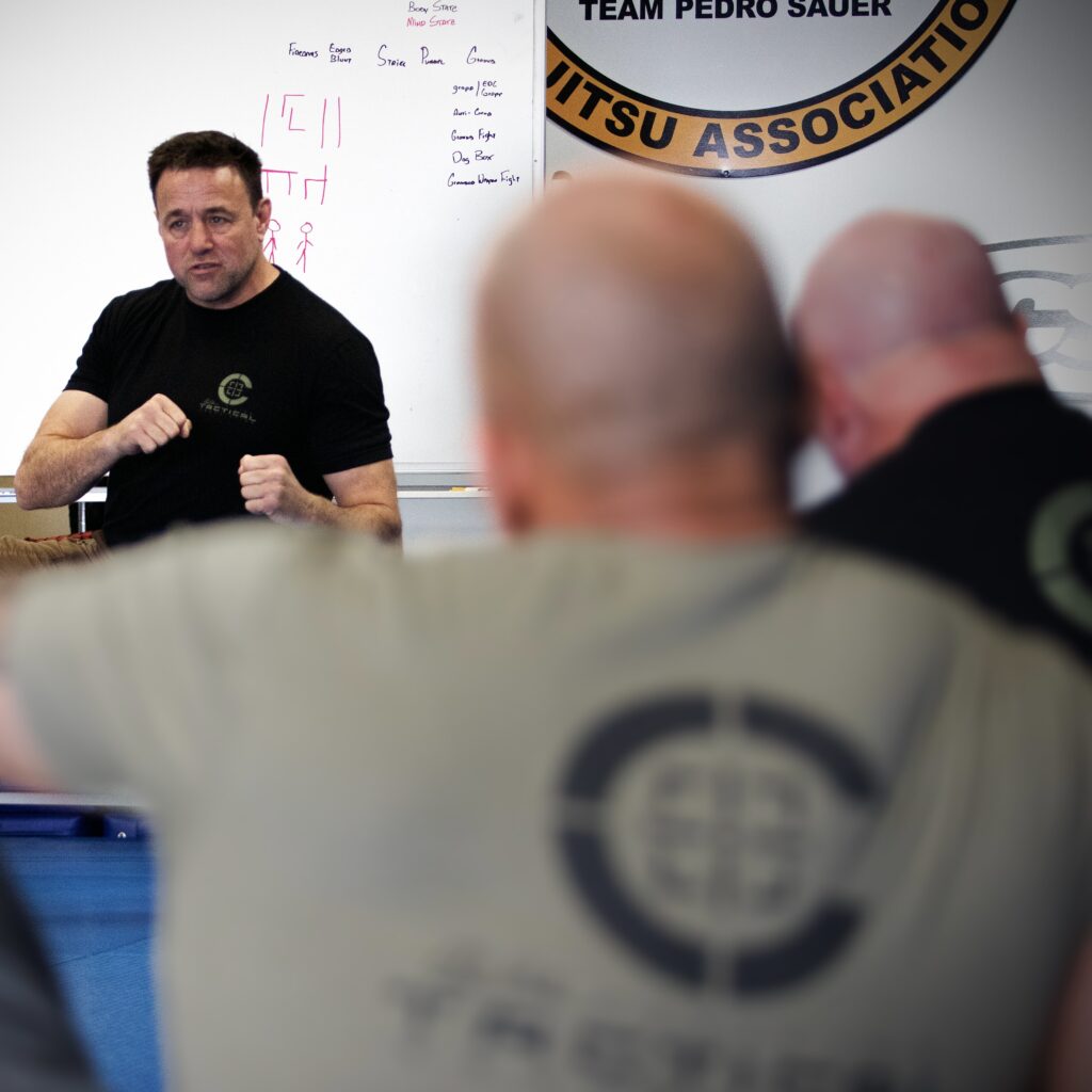 Sifu Guro Alan Baker teaching knife work at a C-Tac instructor training camp 
