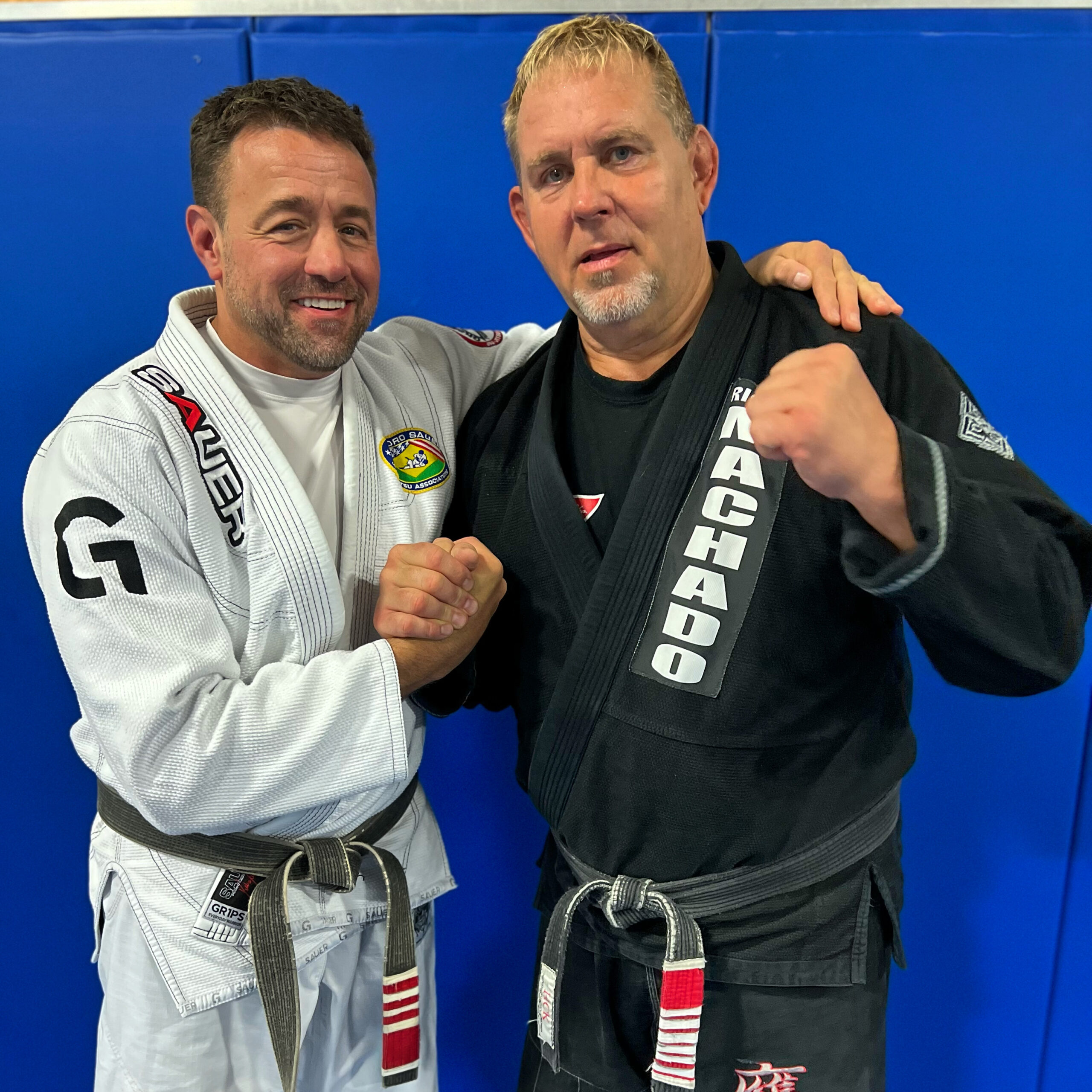 Coach Erik Paulson and Alan Baker in Brazilian Jiu-Jitsu gis