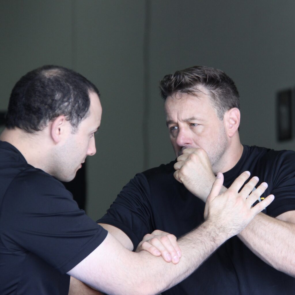 Coach Chris and Sifu Alan Baker working on trappnig drills from the Legacy Jeet Kune Do program. 