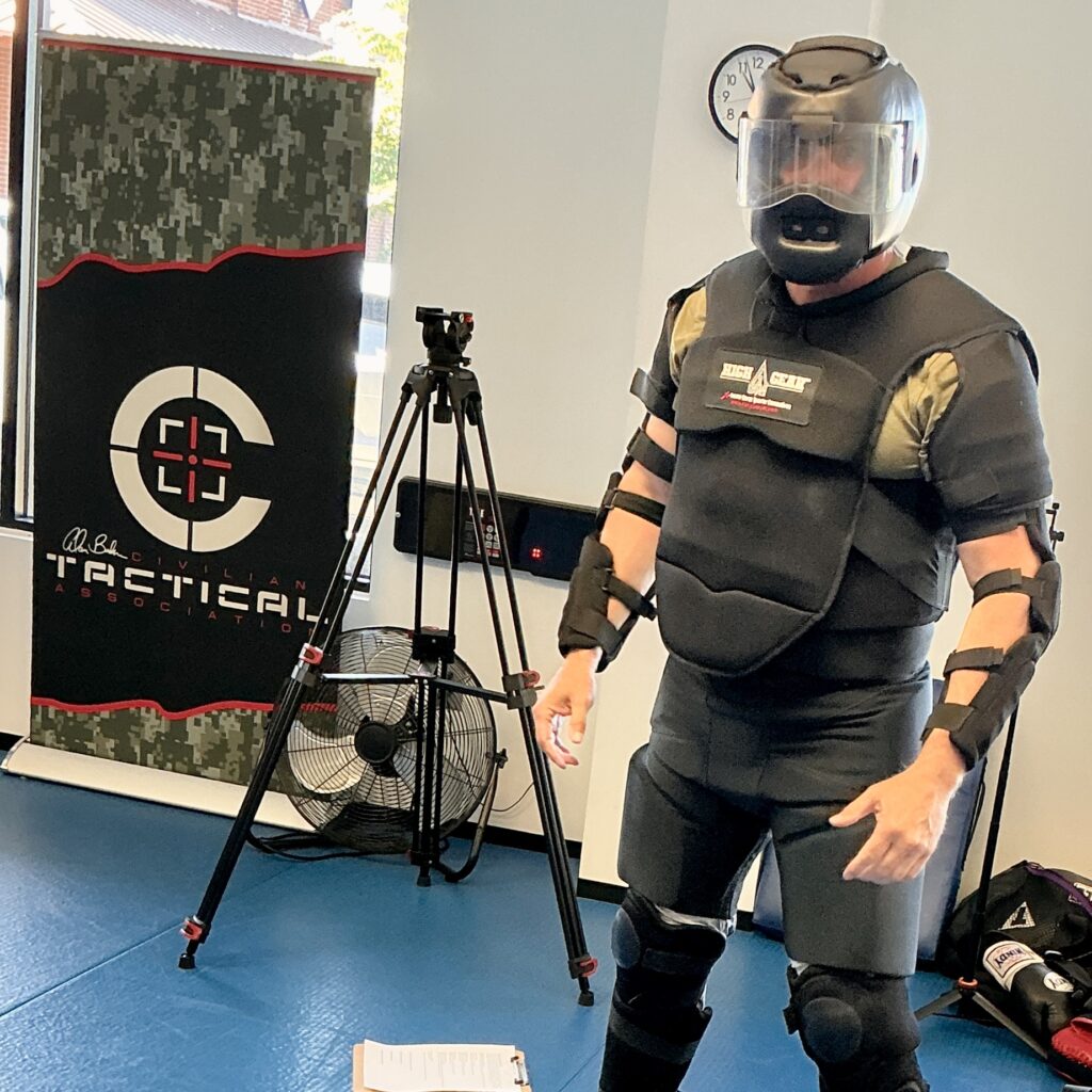 One of the instructors putting on body armor for training at one of the C-Tac instructor training camps in Atlanta, Georgia