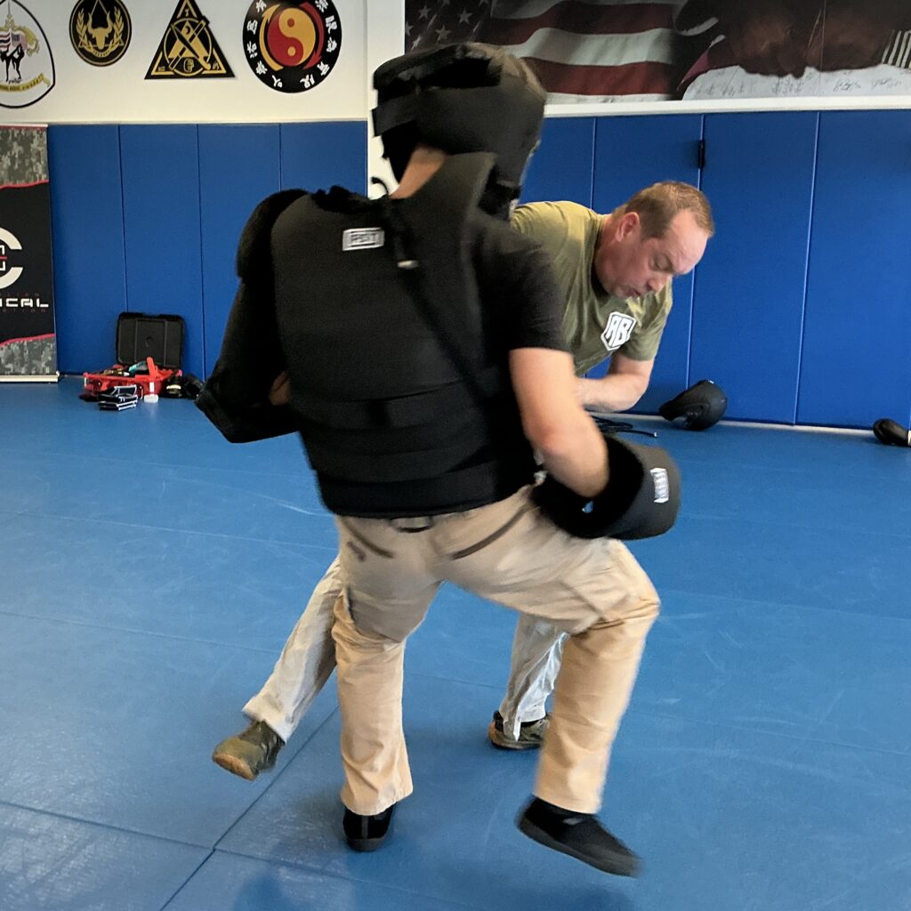 Two of the C-Tac instructors working on a drill that uses body armor at one of the instructor training events in Atlanta, Georgia