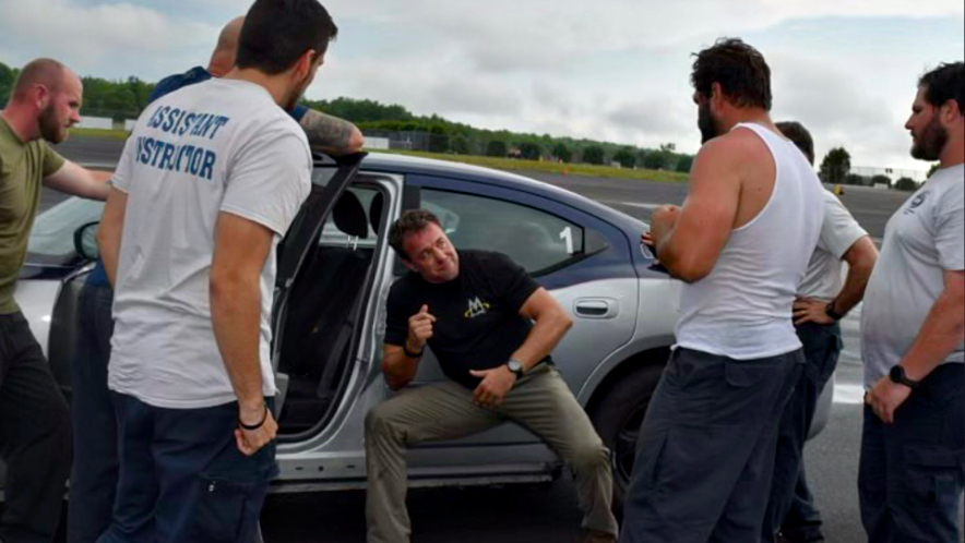 Sifu Alan Baker teaching the Vehicle Centric Defensive Tactics system - Training covers threats that occur inside a vehicle, including aggressive passengers seated beside or behind you, as well as attacks through open windows and doors.