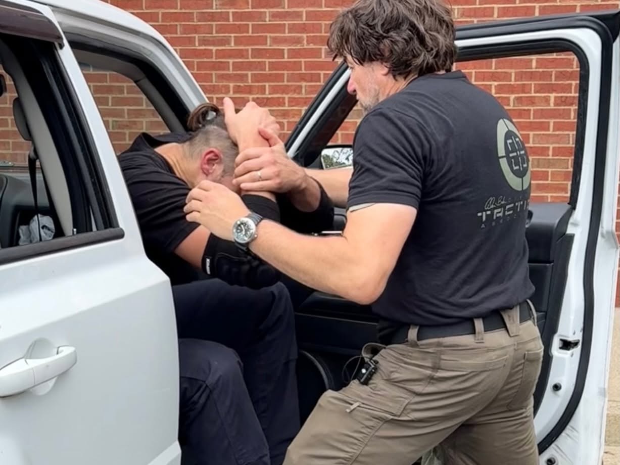 C-TAC instructors working from the confined space of a vehicle