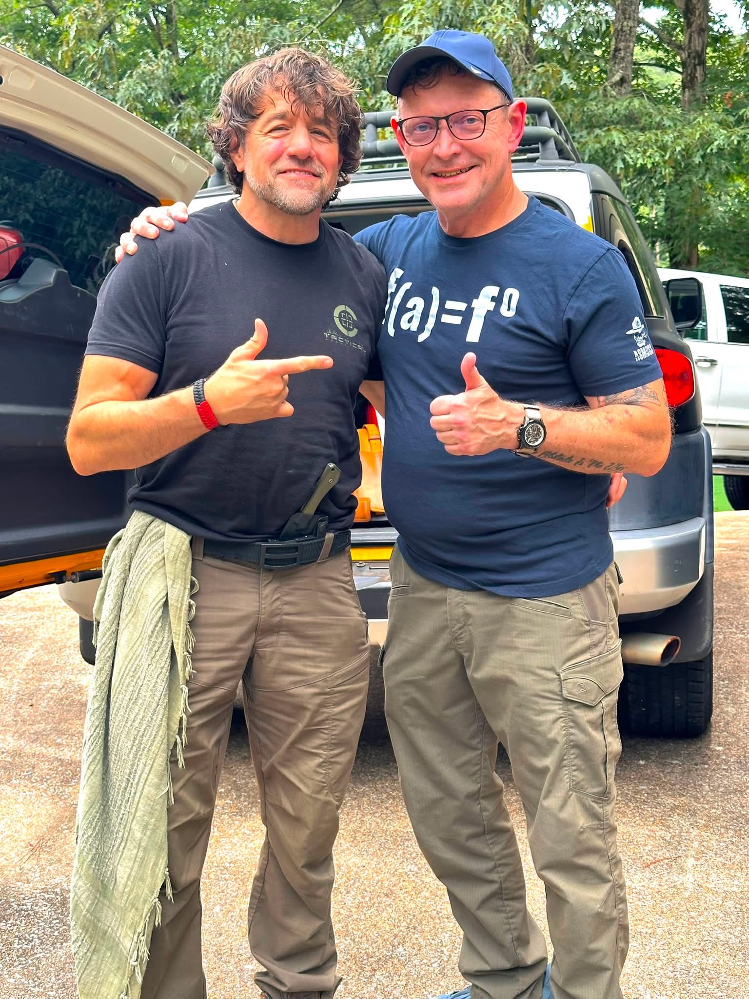 Alan Baker standing with Coach Chris Mize during Combatives at the Lake in Alabama