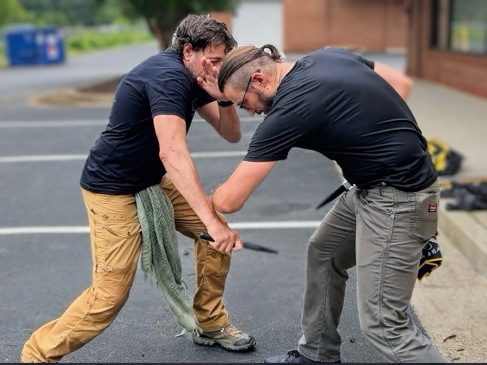C Tac instructors demonstrating a close range defensive tactics problem
